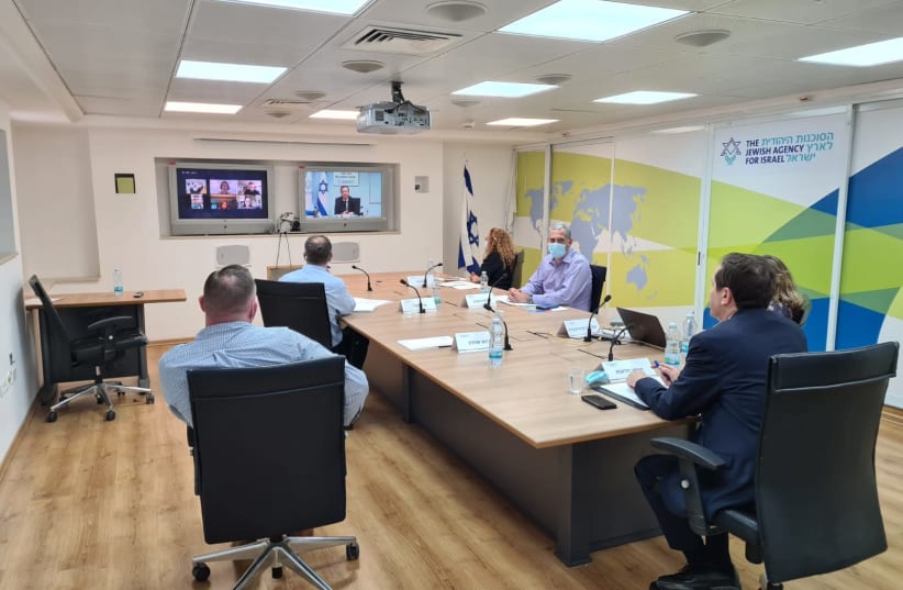 Jewish Agency Chairman Isaac Herzog is seen remotely delivering a briefing. (photo credit: COURTESY OF THE JEWISH AGENCY)
