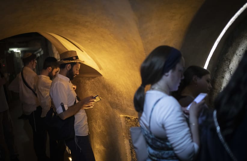 PRAYING IN a Western Wall tunnel at the closest physical point (not under Islamic Wakf jurisdiction) to the Holy of Holies, in Jerusalem’s Old City last year (photo credit: HADAS PARUSH/FLASH90)