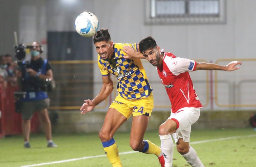 IN A stunning upset, Hapoel Beersheba (in red) defeated Maccabi Tel Aviv 2-0 this week in both teams' final game of the 2019/20 Israel Premier League season, with the result marking the yellow-and-blue's lone loss of the campaign (photo credit: UDI ZITIAT)