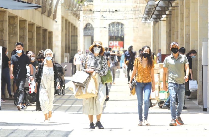 SHOPPERS AT the Mamilla mall in Jerusalem this week. What would the country look like if missiles were falling?  (photo credit: MARC ISRAEL SELLEM/THE JERUSALEM POST)