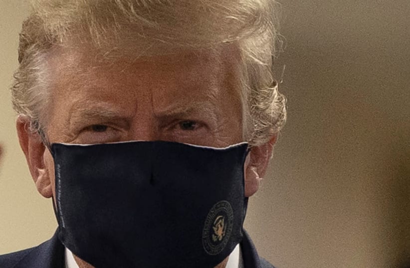 President Donald Trump wears a mask while visiting Walter Reed National Military Medical Center in Bethesda, Maryland, US, July 11, 2020. (photo credit: TASOS KATOPODIS/ REUTERS)