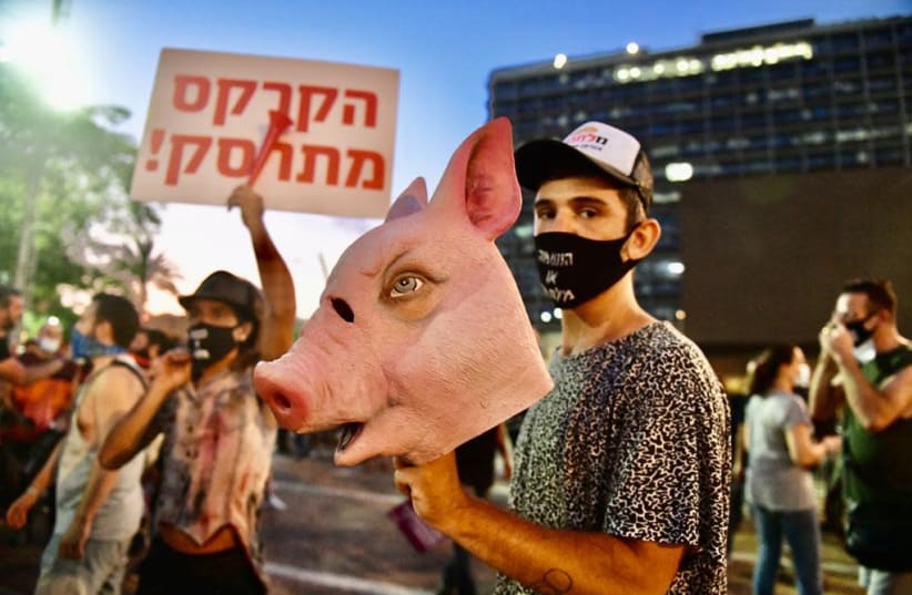 Protesters attend a Rabin Square demonstration against government economic policies amid the coronavirus pandemic (photo credit: AVSHALOM SASSONI)
