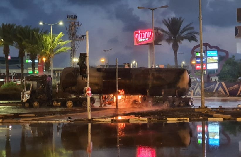 Firefighters extinguish blazing gas tanker in Haifa, July 14, 2020 (photo credit: ISRAEL POLICE)