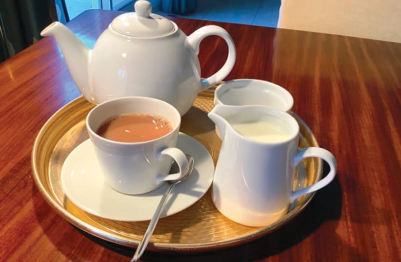 A FILLED tea tray with the essential elements: teapot, cup and saucer, teaspoon, milk jug and sugar bowl. (photo credit: Courtesy)