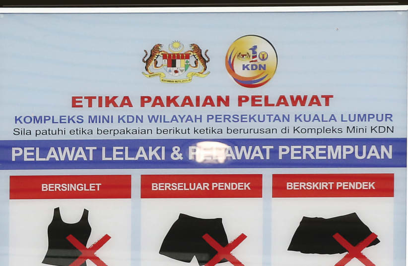 THOSE ENTERING a particular government building in Malaysia need to adhere to this dress code (photo credit: OLIVIA HARRIS/ REUTERS)