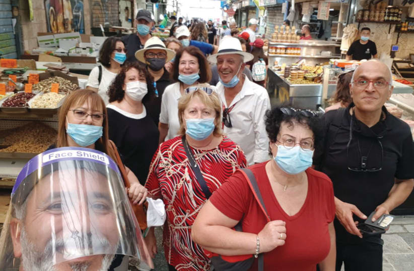 TOURIST AGENTS from around the country get a taste of Jerusalem’s famed Mahaneh Yehuda market (photo credit: YALLA BASTA)