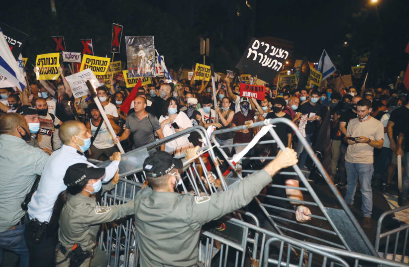 POLICE PUT up additional barricades during an anti-Netanyahu demonstration this week. (photo credit: MARC ISRAEL SELLEM/THE JERUSALEM POST)