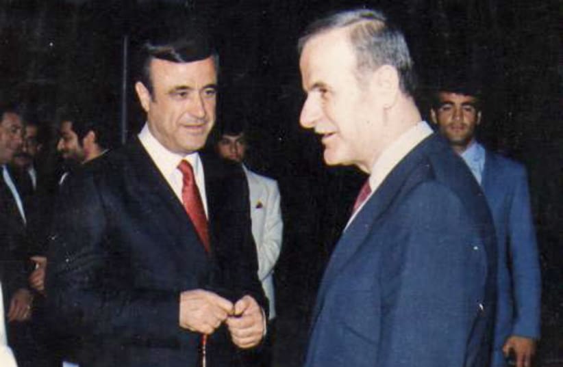Rifaat al-Assad with his brother, former Syrian president Hafez al-Assad (photo credit: Wikimedia Commons)
