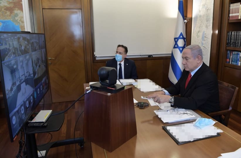 Prime Minister Benjamin Netanyahu begins the weekly cabinet meeting via video, July 19, 2020 (photo credit: KOBI GIDON / GPO)