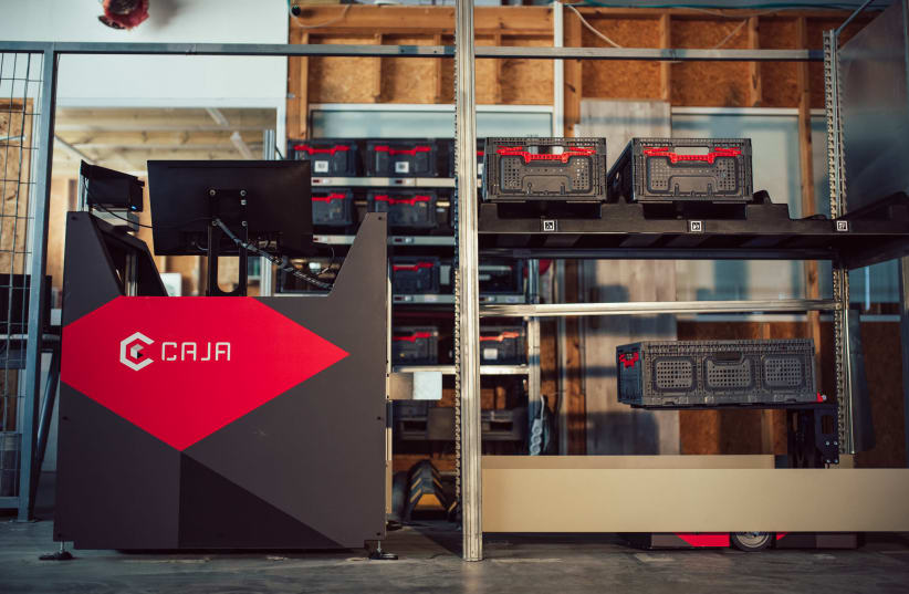 A Caja picker station, to which the robots bring boxes to (photo credit: ASAF RAVIVO)