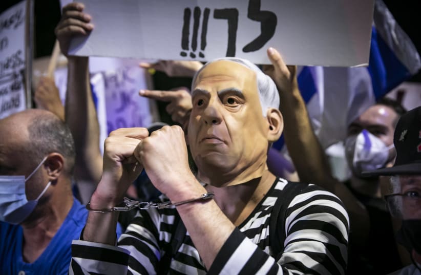 Demonstrators protest against Israeli prime minister Benjamin Netanyahu outside Prime Minister official residence in Jerusalem on July 18, 2020. (photo credit: OLIVIER FITOUSSI/FLASH90)