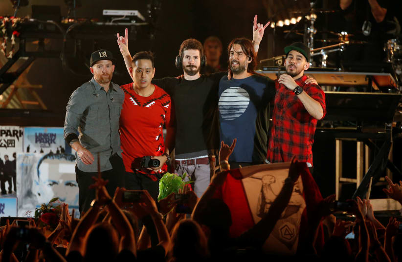 Linkin Park members (L-R) Dave Farrell, Joe Hahn, Brad Delson, Rob Bourdon and Mike Shinoda take the stage at the end of the "Linkin Park & Friends Celebrate Life in Honor of Chester Bennington" concert at Hollywood Bowl in Los Angeles, California, US, October 27, 2017. (photo credit: REUTERS)