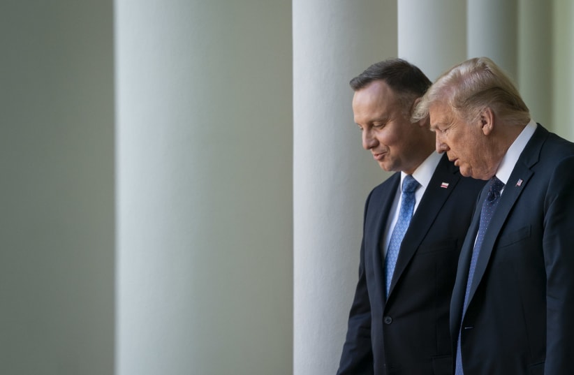 U.S. President Donald Trump and Polish President Andrzej Duda walk to a joint news conference in the Rose Garden of the White House, June 24, 2020. (photo credit: DREW ANGERER / GETTY IMAGES)