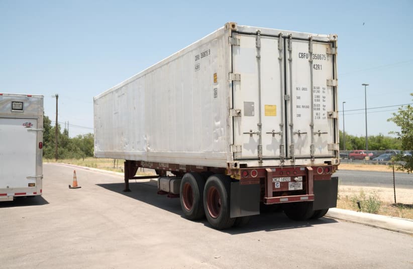 A refrigerated trailer that the San Antonio health authorities acquired to store bodies, as morgues at hospitals and funeral homes reach their capacity with the coronavirus disease (COVID-19) fatalities, is seen in Bexar County, Texas, July 15, 2020. Picture taken July 15, 2020. City of San Antonio/ (photo credit: CITY OF SAN ANTONIO/HANDOUT VIA REUTERS)