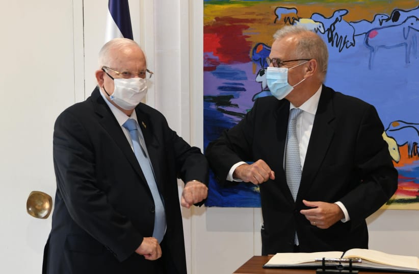 President Reuven Rivlin rubs elbows with Greek Ambassador Panayotis Sarris (photo credit: AMOS BEN GERSHOM, GPO)