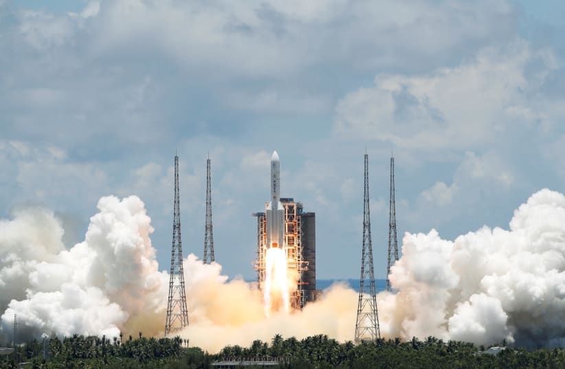 The Long March 5 Y-4 rocket, carrying an unmanned Mars probe of the Tianwen-1 mission, takes off from Wenchang Space Launch Center in Wenchang, Hainan Province, China July 23, 2020. (photo credit: REUTERS/CARLOS GARCIA RAWLINS)