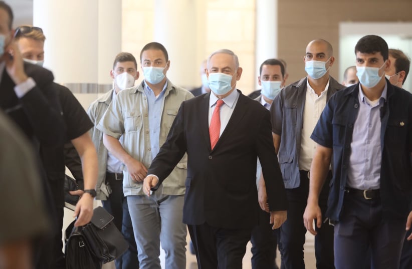 Prime Minister Benjamin Netanyahu wearing a medical mask amid coronavirus pandemic (photo credit: MARC ISRAEL SELLEM)