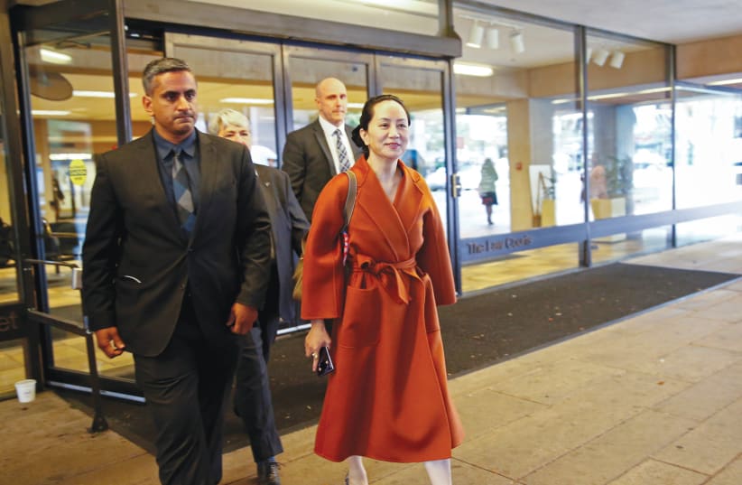 MENG WANZHOU leaves the British Columbia Supreme Court in Vancouver in September. (photo credit: LINDSEY WASSON/REUTERS)