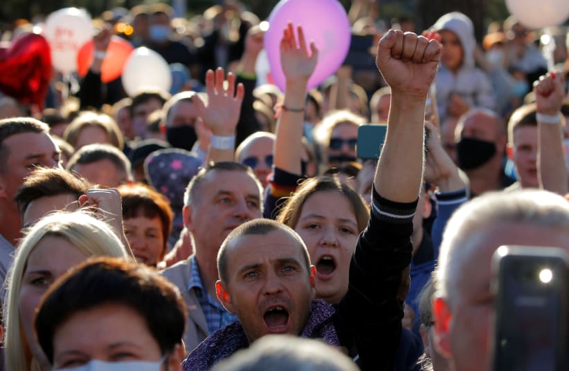 Supporters of presidential candidate Sviatlana Tichanouskaya attend an election campaign rally in Barysau (photo credit: VASILY FEDOSENKO / REUTERS)