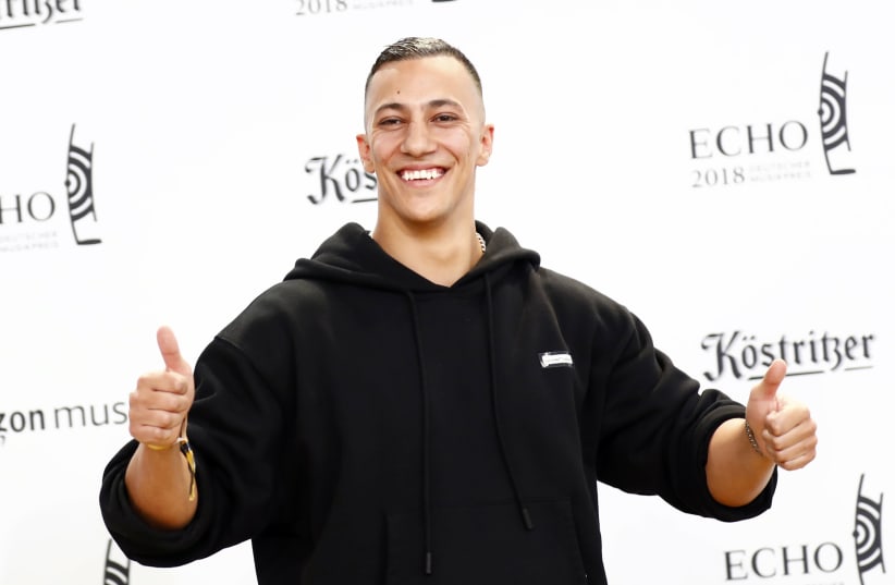 German rapper Farid Bang poses during a photocall upon arrival for the 2018 Echo Music Award ceremony in Berlin, Germany April 12, 2018. (photo credit: AXEL SCHMIDT/REUTERS)