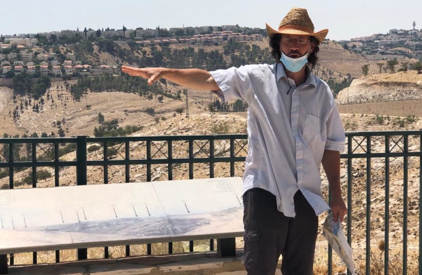 Ir Amim researcher Aviv Tatarsky on the E1 hilltop.  (photo credit: TOVAH LAZAROFF)