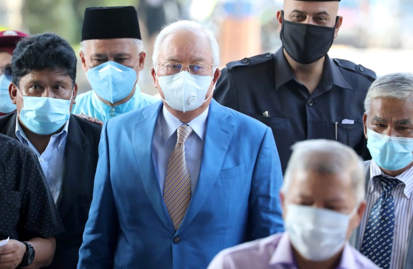 Former Malaysian Prime Minister Najib Razak and his supporters arrive at Kuala Lumpur High Court in Kuala Lumpur (photo credit: REUTERS)