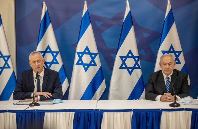 Israeli prime minister Benjamin Netanyahu and Alternate Prime Minister and Minister of Defense Benny Gantz hold a press conference in Tel Aviv on July 27, 2020. (photo credit: TAL SHAHAR/POOL)