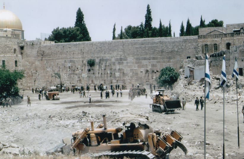 The hovels blocking access to the Western Wall for centuries are bulldozed following the Six Day War (photo credit: Wikimedia Commons)