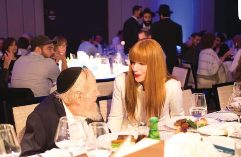 THE WRITER with Rabbi Steinsaltz at the event: ‘The Rabbi’s incredible mind is not “packaged” in a typical, powerful rabbi’s type of image we would expect.’ (photo credit: YISRAEL BARDOGO)