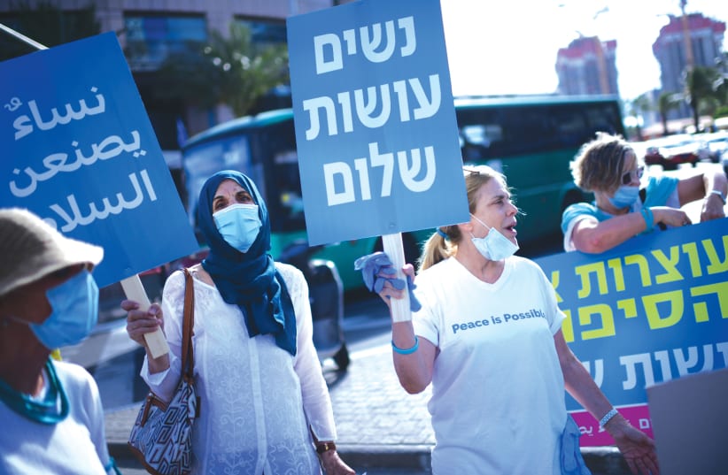 WOMEN FROM the ‘Women Wage Peace’ movement protest US President Donald Trump’s ‘Deal of the Century,’ in Tel Aviv, last month. (photo credit: TOMER NEUBERG/FLASH90)