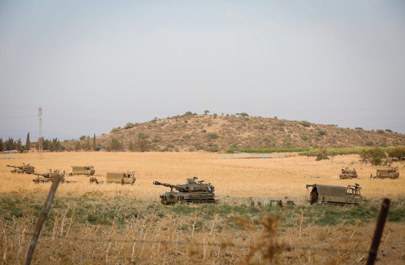 IDF TROOPS are seen stationed near the border between Israel and Lebanon in the Golan Heights, this week. (photo credit: DAVID COHEN/FLASH 90)