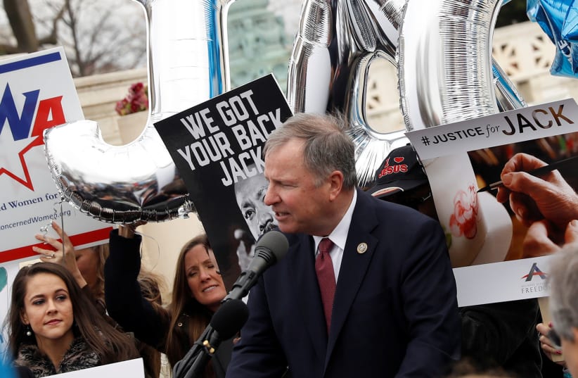 Congressman Doug Lamborn (R-CO) speaks to demonstrators following oral arguments in the Masterpiece Cakeshop vs. Colorado Civil Rights Commission case at the Supreme Court in Washington, US, December 5, 2017.  (photo credit: AARON P. BERNSTEIN/ REUTERS)