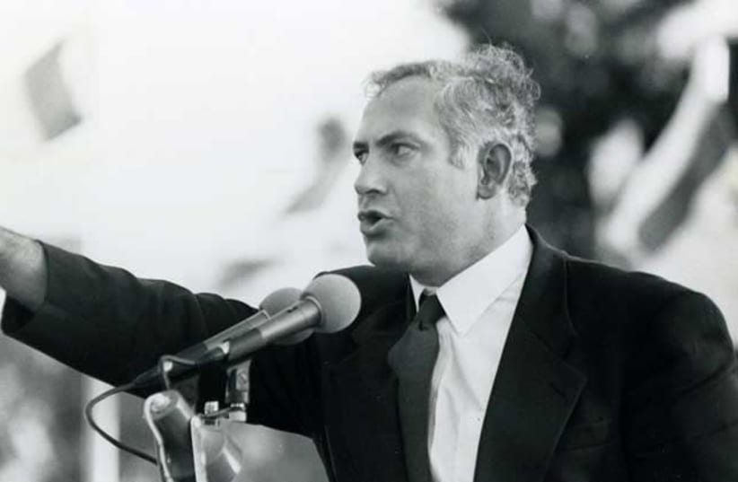 Benjamin Netanyahu, then only a Likud MK, is seen in a controversial photo from a rally in 1992, which was republished after being redacted for 28 years.  (photo credit: ALEX LIBAK)