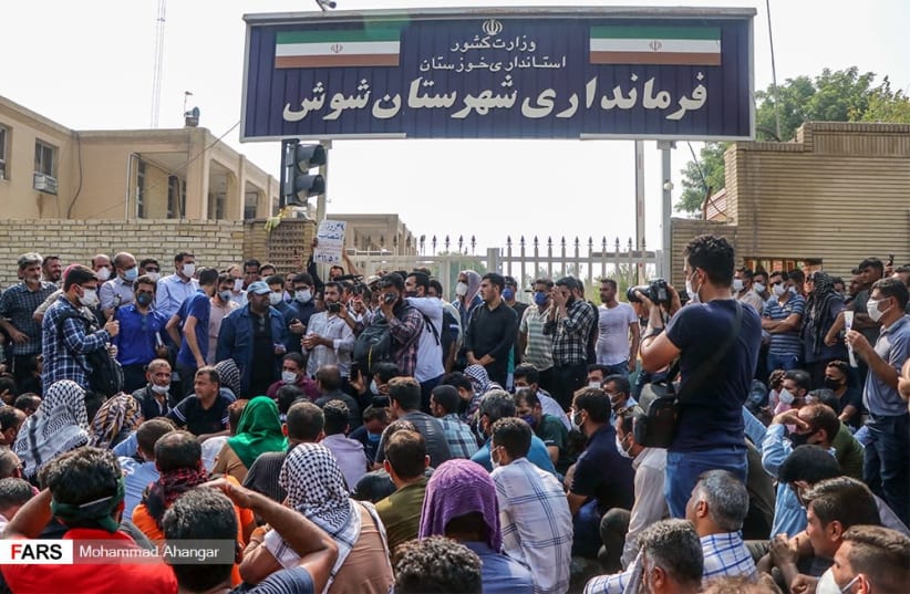 Iranians protest at the Haft Tappeh Sugarcane Industrial Complex, August, 2020 (photo credit: MOHAMMAD AHANGAR/FARS NEWS AGENCY)