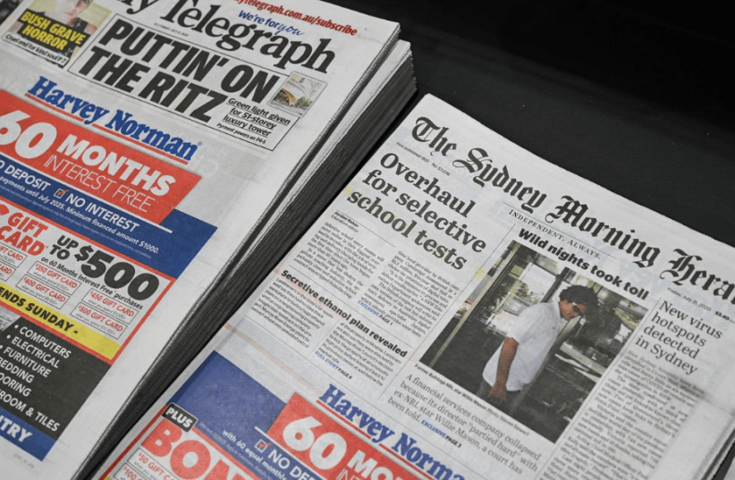 Newspapers are seen for sale at a shop in Sydney, Australia, July 31, 2020. (photo credit: LOREN ELLIOTT/REUTERS)