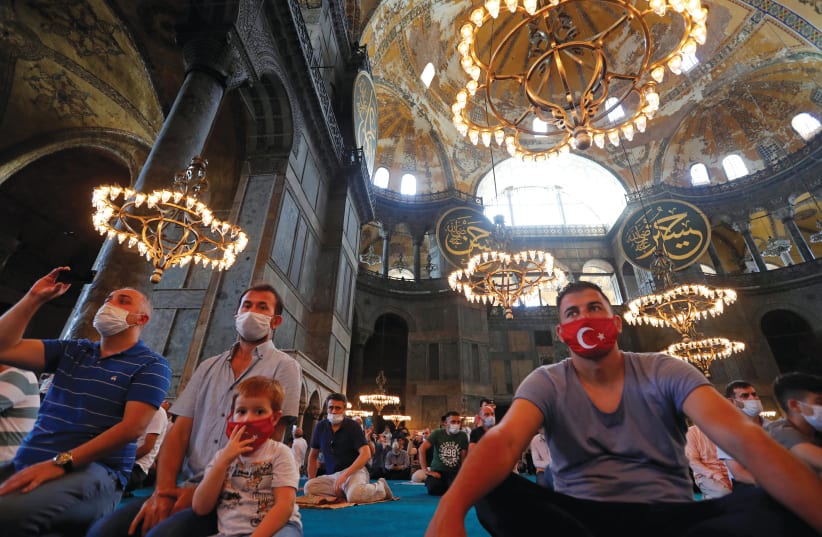 WORSHIPPERS TAKE part in afternoon prayers at Hagia Sophia, newly designated a mosque, in Istanbul on July 26 (photo credit: REUTERS/MURAD SEZER)