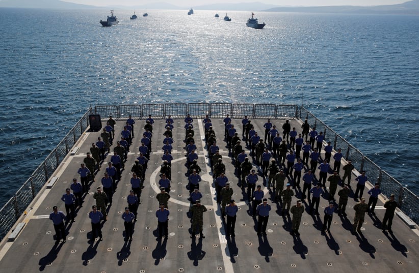 CREW MEMBERS of the amphibious landing ship tank ‘TCG Bayraktar’ pose after a landing drill during the Blue Homeland naval exercise in Izmir Bay, Turkey, in March 2019. (photo credit: REUTERS/MURAD SEZER)