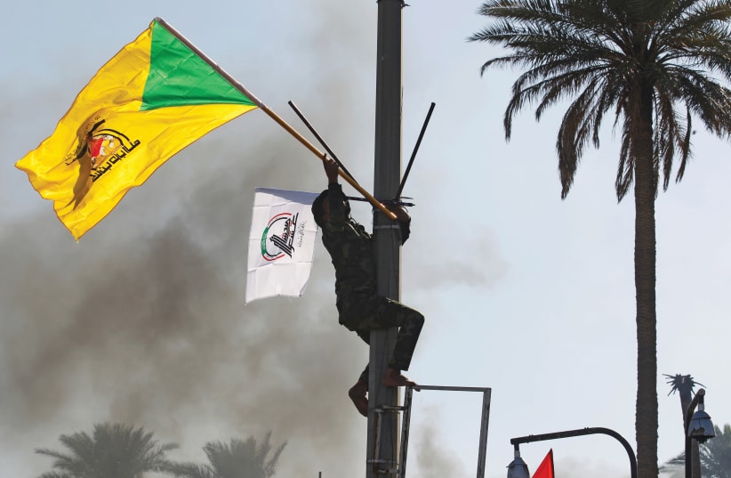 ‘THERE IS no dispute between Lebanon and Israel over any territory, so why is Iran funding Hezbollah?’ (Pictured: Hezbollah flag) (photo credit: REUTERS/KHALID AL MOUSILY)