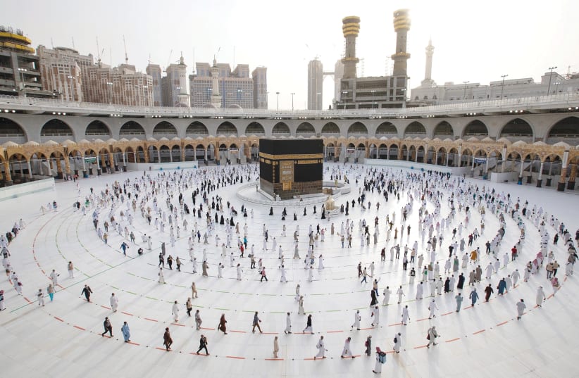 PILGRIMS MAINTAIN social distance as they mark the end of the Haj, in Mecca, Saudi Arabia, on August 2. (photo credit: SULTAN AL-MASOUDI/HANDOUT VIA REUTERS)
