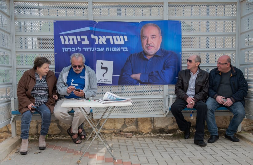 Election campaign posters outside a voting station in Karnei Shomron, in the West Bank, during the Knesset Elections, on March 2, 2020. (photo credit: SRAYA DIAMANT/FLASH90)