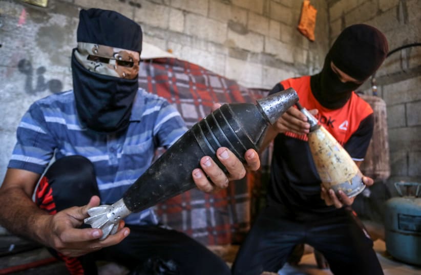 Palestinians prepare balloons attached with flammable materials to be released into Israel from Gaza, in Rafah, southern Gaza Strip, on August 8, 2020. (photo credit: ABED RAHIM KHATIB/FLASH90)