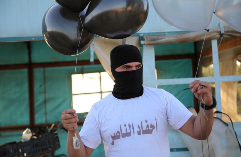 Gaza balloon units prepare incendiary and explosive balloons to launch towards Israel, August 2020 (photo credit: AHFAD AL-NASSER BALLOON UNIT/TELEGRAM)