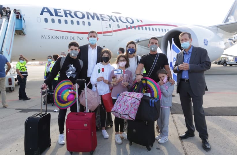 Mercado family just landing from Mexico, with Jewish Agency Chairman Isaac Herzog (far right) and Chairman of Keren Hayesod Sam Grundwerg (back). (photo credit: DAVID SALEM - THE JEWISH AGENCY FOR ISRAEL)