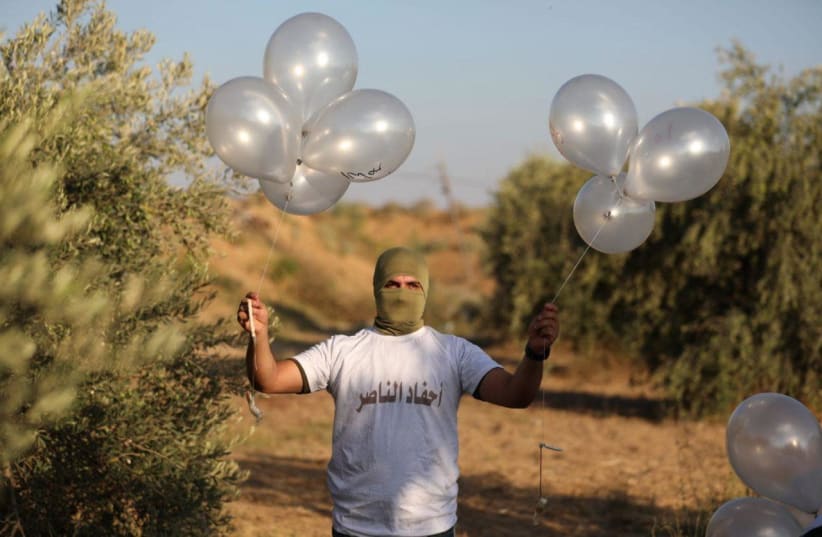 Balloon units prepare incendiary and explosive balloons to launch towards Israel, August 12, 2020 (photo credit: SONS OF AL-ZAWARI BALLOON UNIT/TELEGRAM)