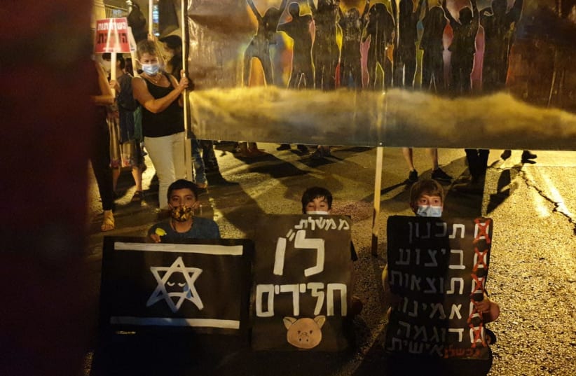Children join anti-Netanyahu protests on August 15, 2020 (photo credit: TAMAR BEERI)