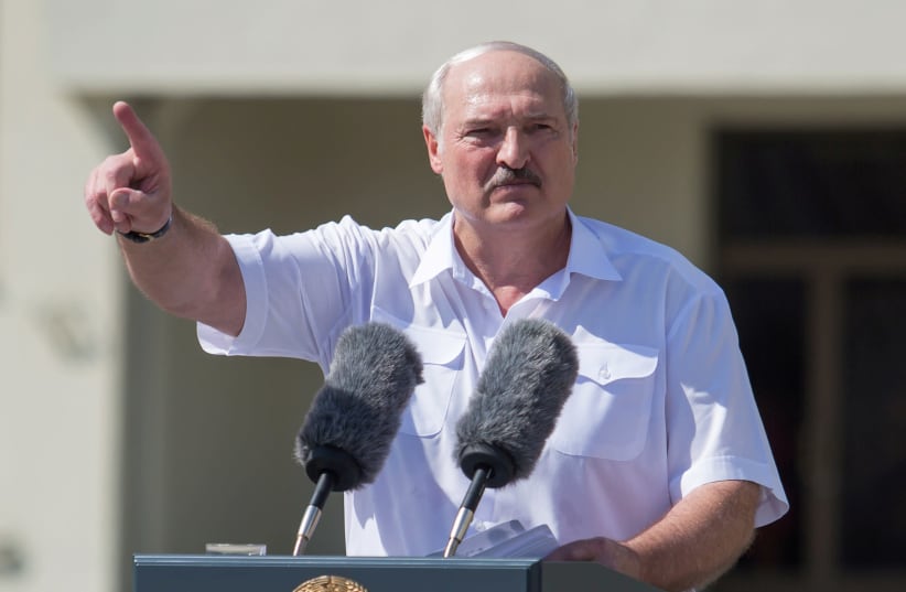 Belarusian President Alexander Lukashenko gestures as he delivers a speech during a rally of his supporters near the Government House in Independence Square in Minsk, Belarus August 16, 2020 (photo credit: REUTERS/STRINGER)