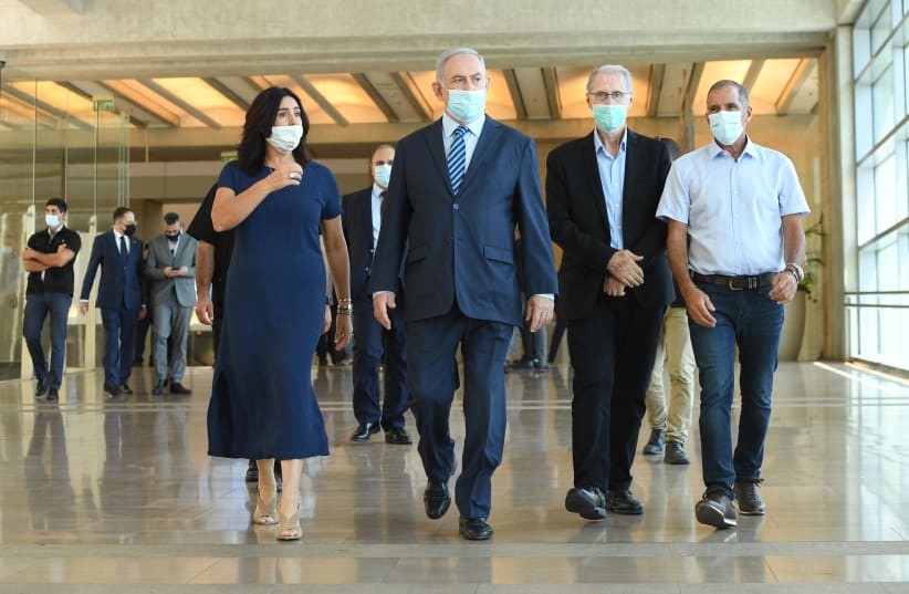 Prime Minister Benjamin Netanyahuand Transportation Minister Miri Regev  visit Ben-Gurion Airport to oversee the reopening of the skies, August 17, 2020 (photo credit: CHAIM TZACH/GPO)