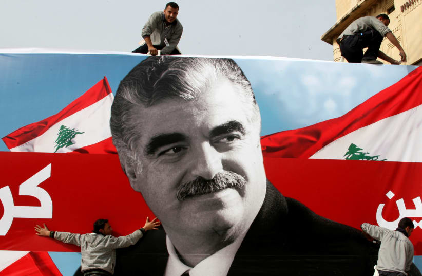 Workers prepare a giant poster depicting Lebanon's assassinated former prime minister Rafik al-Hariri, in downtown Beirut, Lebanon February 12, 2010 (photo credit: REUTERS/MOHAMED AZAKIR)