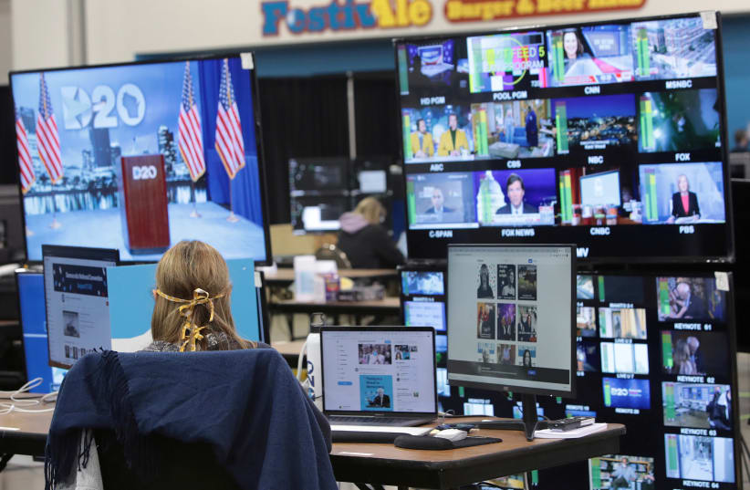The control room where live feeds are managed is in operation for the first night of the virtual Democratic National Convention (DNC) at the Wisconsin Center in Milwaukee, Wisconsin, US August 17, 2020. (photo credit: SCOTT OLSON/POOL VIA REUTERS)
