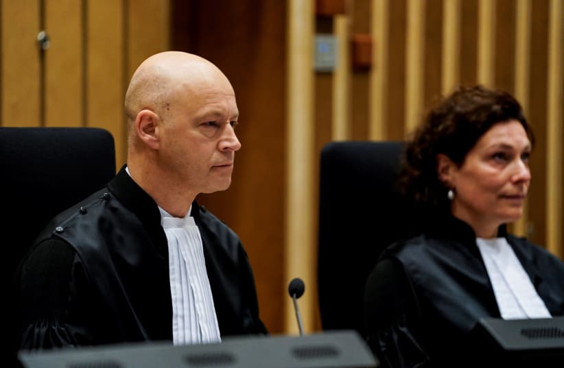 A Dutch judge, Hendrik Steenhuis, presides over a hearing at the Schiphol Judicial Court complex in Badhoevedorp, March 9, 2020.  (photo credit: KENZO TRIBOUILLARD / AFP)